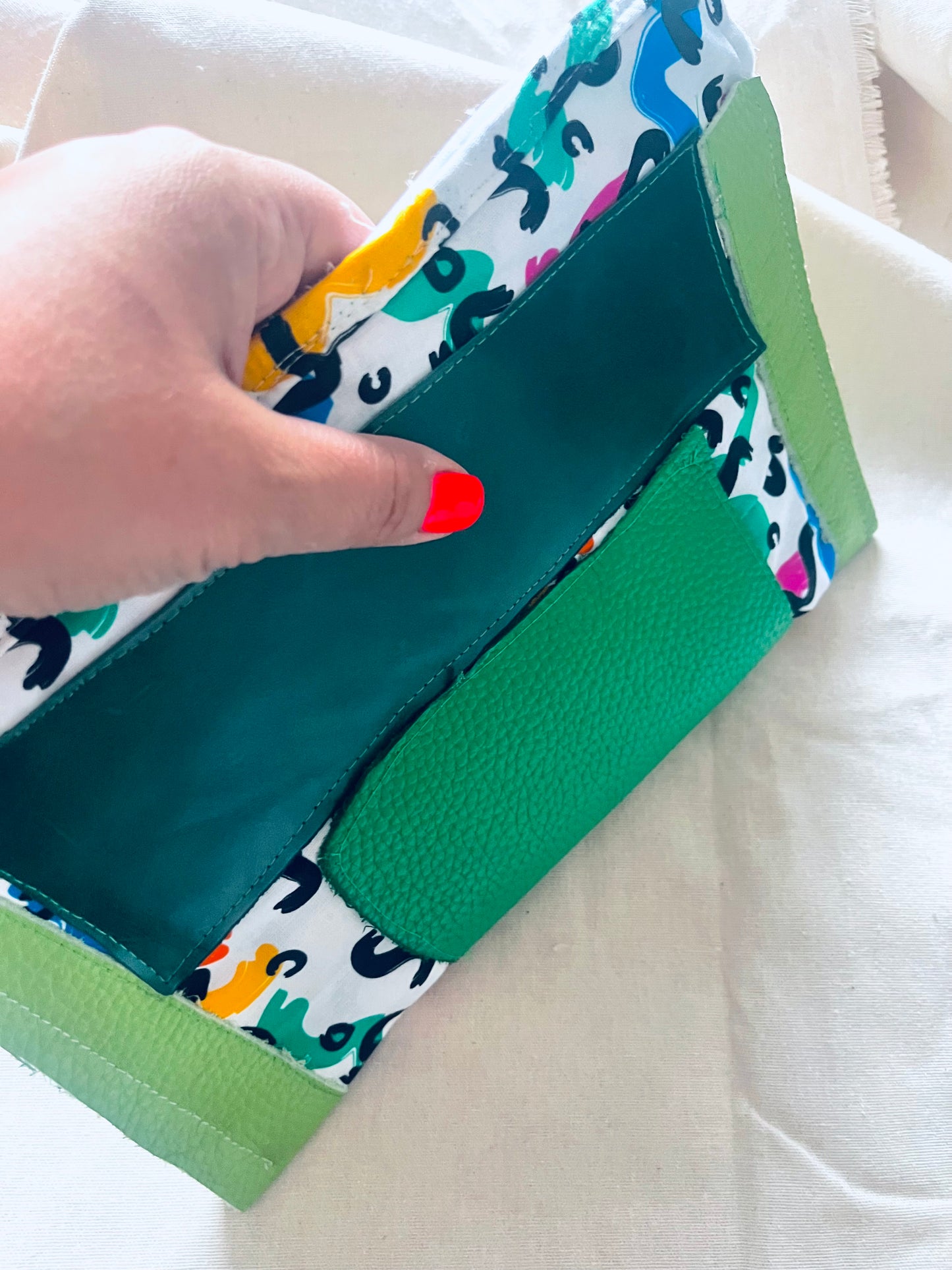 Green leather clutch