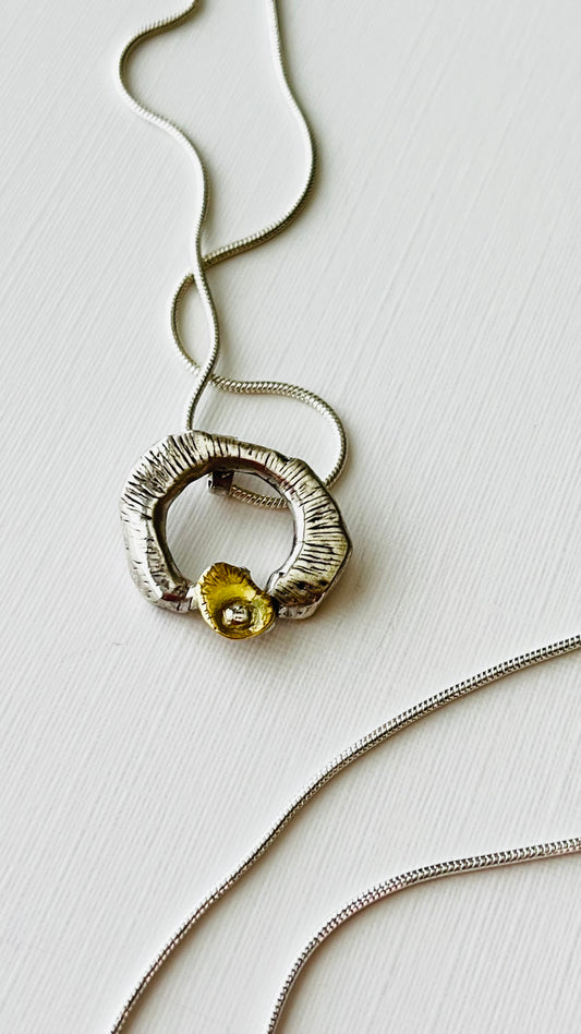 Gold and silver ripple pendant